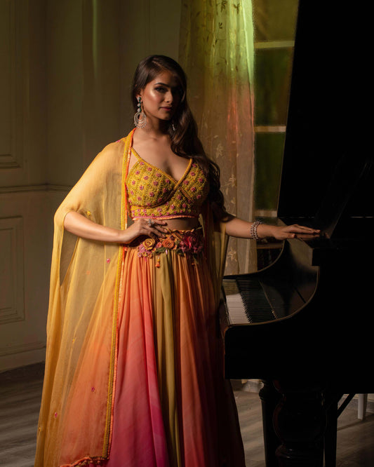Yellow pink lehenga with quarter sleeved blouse and dupatta